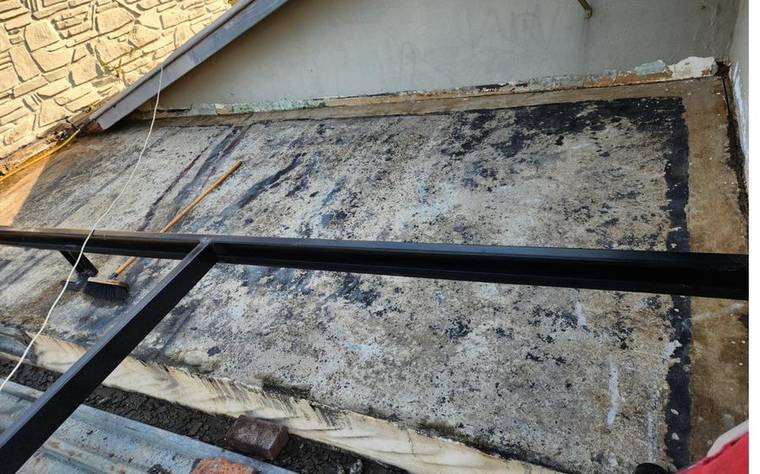 A cracked, weathered flat roof in Pretoria East before waterproofing
