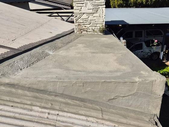 A parapet wall cleaned and prepared before coating