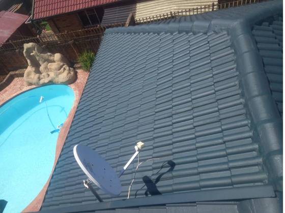 A concrete tile roof coated in Dark Grey Hybrid Liquid Rubber
